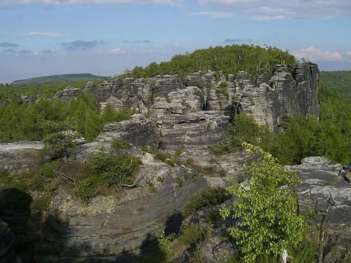 a large rock formation on top of a mountain at hostinec Thérése in Petrovice