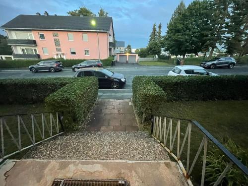 a driveway with cars parked in a parking lot at Appartement in Hof Bayern in Hof