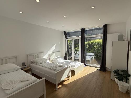 Katil atau katil-katil dalam bilik di CityStay Bergisch Gladbach Apartments & Rooms