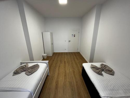 Katil atau katil-katil dalam bilik di CityStay Bergisch Gladbach Apartments & Rooms