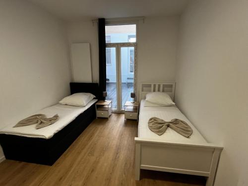Katil atau katil-katil dalam bilik di CityStay Bergisch Gladbach Apartments & Rooms