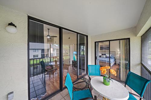 a patio with a table and chairs on a balcony at Stylish and Modern Shorewalk condo close to top beaches, heated pools, hot tub, IMG Academy, dining in Bradenton