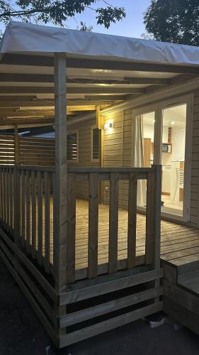 a deck with a tent on top of it at Farniente en Cévennes in Génolhac