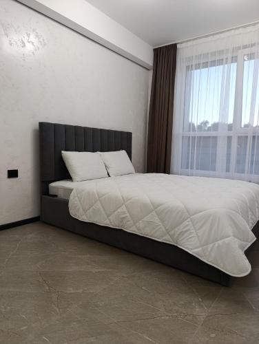 Postel nebo postele na pokoji v ubytování Апартаменти Ашан Автовокзал Стрийська