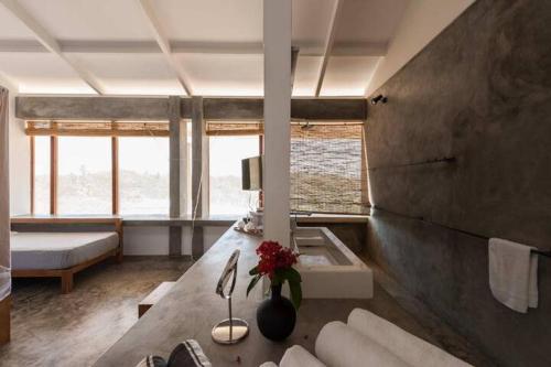 a living room with a couch and a table with flowers at Super Villa In Unawatuna Sunny beach in Kadawatha