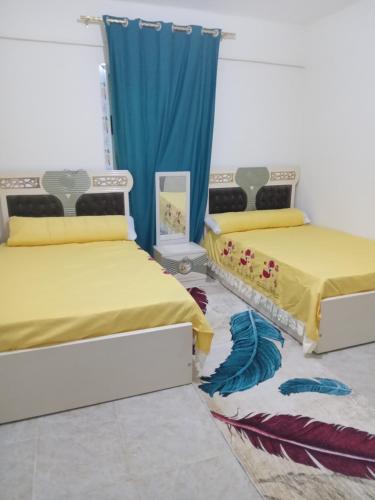 Ένα ή περισσότερα κρεβάτια σε δωμάτιο στο Near Pyramids Apartment