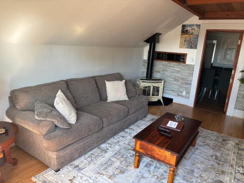a living room with a couch and a coffee table at Alameda 3BR luxury Penthouse 2 blocks to downtown 3 blocks to the beach AC and 2 free parking spaces in Alameda