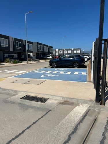 a car is parked in a parking lot at Casa elegante privada y moderna in Coquimbo