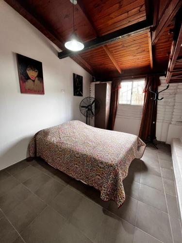 Postel nebo postele na pokoji v ubytování Rincón de los Cerros Colorados