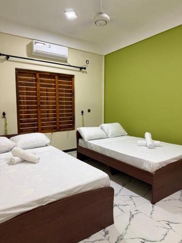 Ένα ή περισσότερα κρεβάτια σε δωμάτιο στο Siva Villas