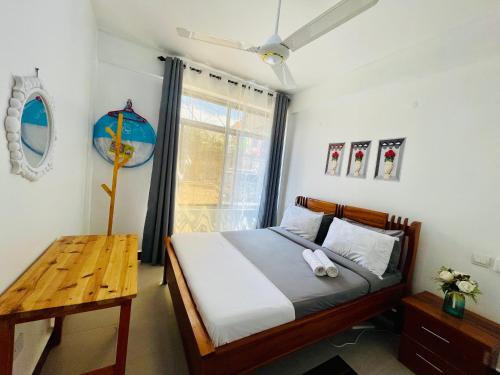 Ένα ή περισσότερα κρεβάτια σε δωμάτιο στο Beach Studio Apartment