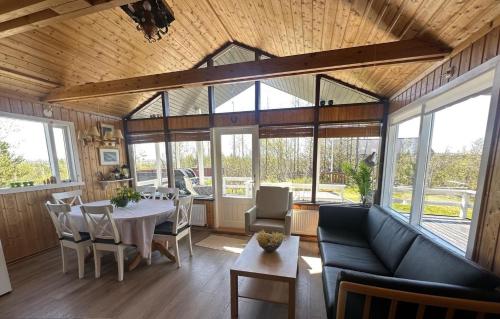a living room with a table and a couch at Aurora Oasis on the Golden Circle in Úthlid
