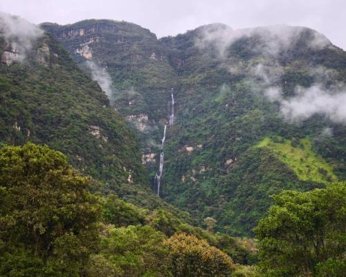 a mountain with a waterfall on the side of it at Choachi casa colibri in Choachí