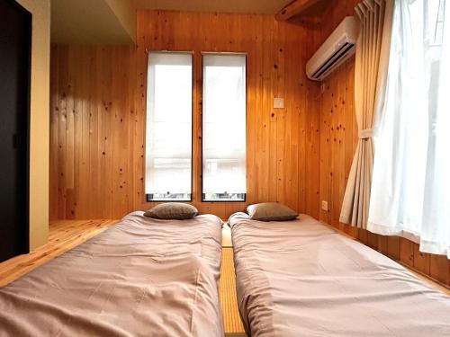 Postel nebo postele na pokoji v ubytování 楽宿箱根 Rakuyado Hakone