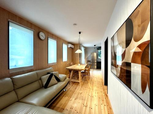 a living room with a couch and a table at 楽宿箱根 Rakuyado Hakone in Hakone