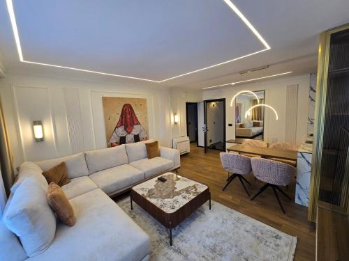 a living room with a couch and a table at Apartments Lura in Peje