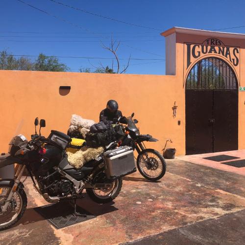 two motorcycles parked in front of a building at Tres Iguanas Apart Hotel - New, cozy & spacious flats, short walk to beach in Loreto