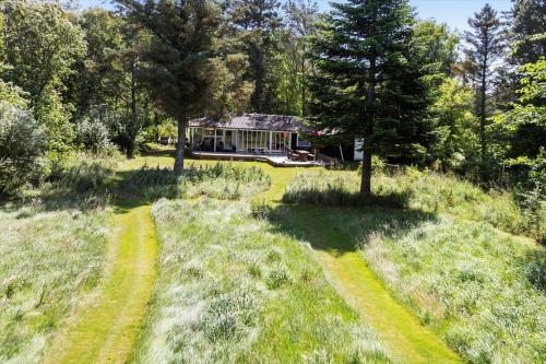 a house in the middle of a field with two paths at LF13175-Nykobing-Mors-Utkaeret-1 in Ejerslev
