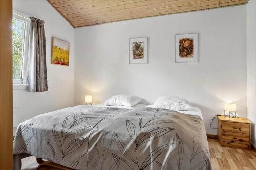 a bedroom with a large bed and a window at LF454-Vestervig-Hannesvej-24 in Vestervig