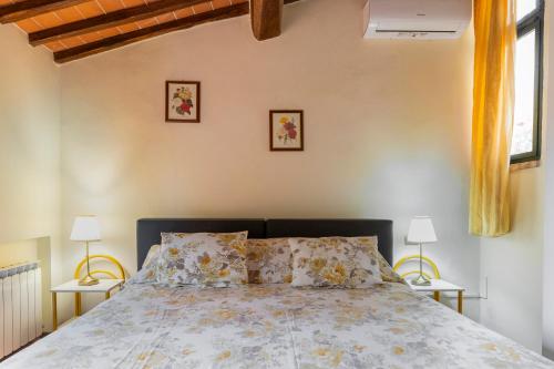 Ένα ή περισσότερα κρεβάτια σε δωμάτιο στο Villa Capannina