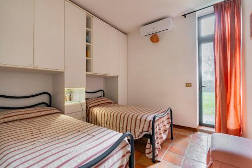 Ένα ή περισσότερα κρεβάτια σε δωμάτιο στο Villa Capannina