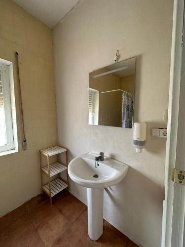 a bathroom with a sink and a mirror at Casa rural habitaciones Dar Alpujarra in Órgiva
