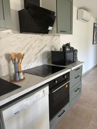 Η κουζίνα ή μικρή κουζίνα στο Logement dans un centre équestre