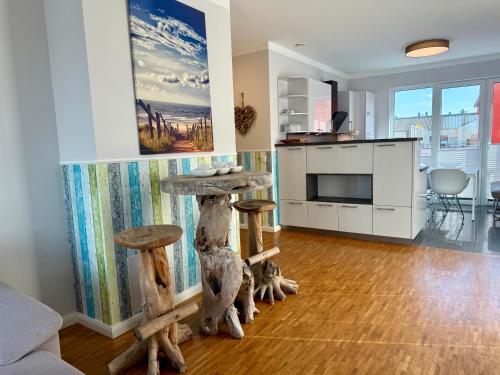 Kuchyň nebo kuchyňský kout v ubytování PrimeLoft "Frische Brise" - Penthouse - Fahrstuhl - modern & geräumig - Familien - Dachterasse - Tiefgarage