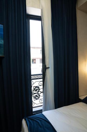 Postel nebo postele na pokoji v ubytování Prime Suites Hotel