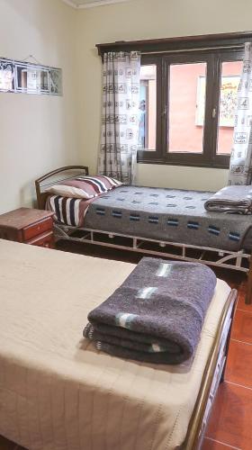 Postel nebo postele na pokoji v ubytování Casa los Molles Hostel