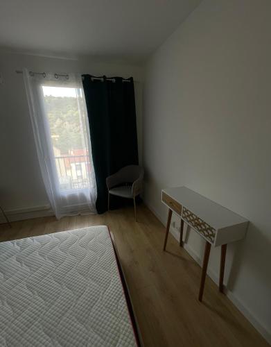 a small room with a table and a window at Aparthotel New Palmarium in Amélie-les-Bains-Palalda