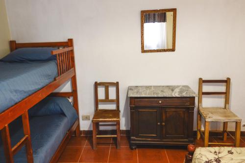Postel nebo postele na pokoji v ubytování Casa los Molles Hostel