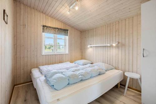 a bedroom with a bed in a room with a window at FY139-Middelfart-Altairvej-20 in Middelfart