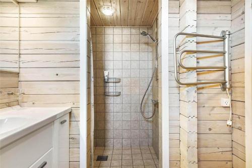 a bathroom with a shower and a sink at 128-Ringkobing-Troldedalen-18 in Nørby
