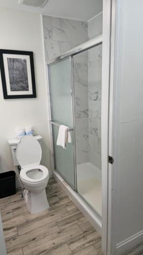 a bathroom with a toilet and a glass shower at La Quinta by Wyndham Sevierville / Kodak in Sevierville