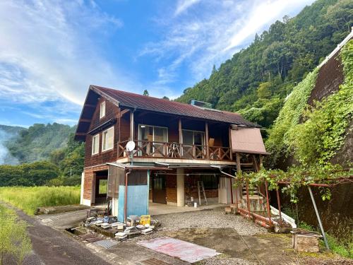 a house in the middle of a mountain at Koguchi Village by WhyKumano in Shingu