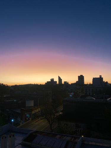 a view of a city skyline at sunset at Charming flat with big private Terrace in Montevideo