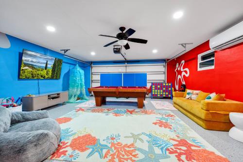 a living room with a pool table at Lexy Beach House in Cape Canaveral