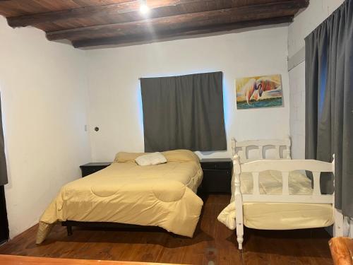 Ένα ή περισσότερα κρεβάτια σε δωμάτιο στο Casita en la cumbre