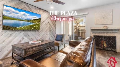 a living room with a couch and a fireplace at The Plaza - An Irvie Home w Summer Pool in Albuquerque