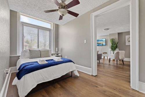 a bedroom with a bed and a ceiling fan at Trendy Ohio City Parking Wifi Mins to DT in Cleveland