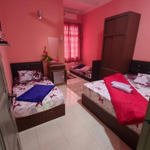Кровать или кровати в номере Quddus Inn villa