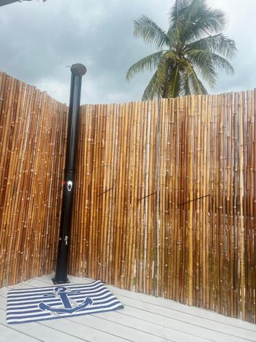 a baseball bat sitting next to a wooden fence at All Decked Out, Exuma in Georgetown