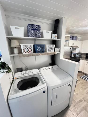a laundry room with a washer and dryer at All Decked Out, Exuma in Georgetown