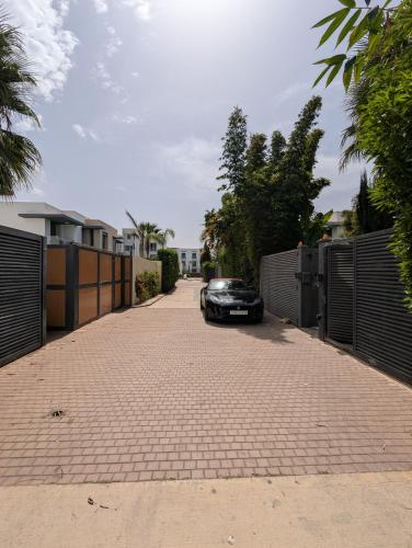 a car parked on a driveway next to a fence at Villa 3-bedroom with Private Pool in Tamaris in Tamaris