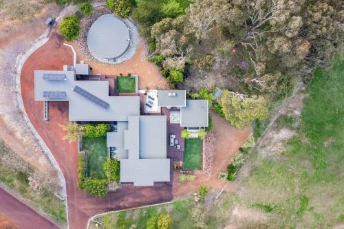 an aerial view of a house with a yard at Sunrise Tranquillity - Luxe Retreat with Heated Spa in Yallingup Siding
