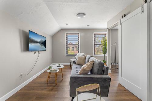 a living room with a couch and a table at Luxe Mattresses Pet Friendly Free Prkng WiFi in Cleveland