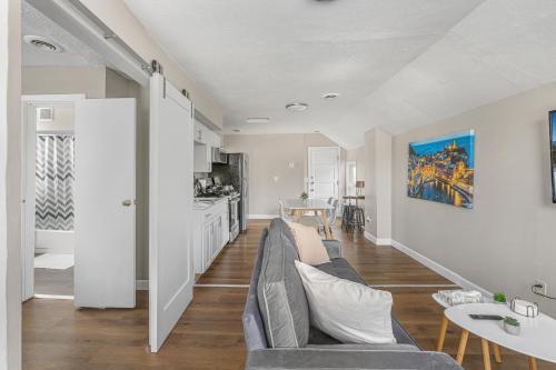 a living room with a couch and a table at Luxe Mattresses Pet Friendly Free Prkng WiFi in Cleveland