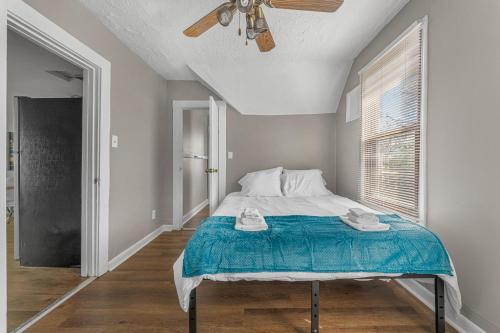 a bedroom with a bed and a ceiling fan at Luxe Mattresses Pet Friendly Free Prkng WiFi in Cleveland