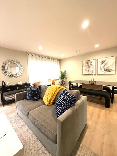 a living room with a couch and a table at Coastal Escape in Redondo Beach in Redondo Beach